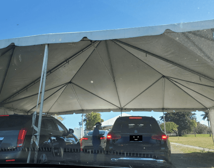 People being tested for Covid in their cars at one of the tents at the Homestead Air Reserve Covid testing center in Homestead Florida.
