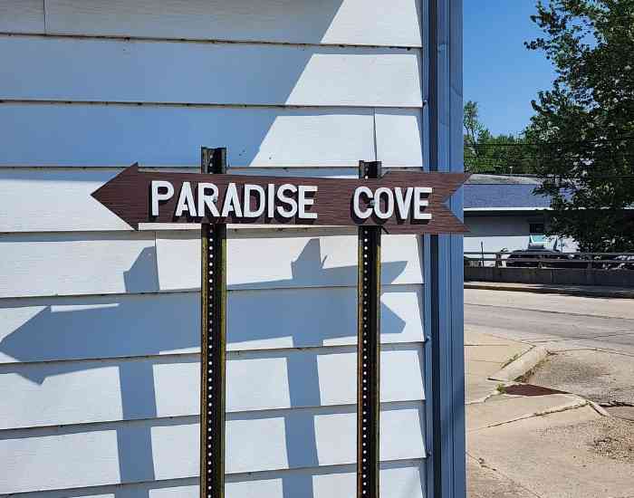 A sign directing you to Paradise Cove.